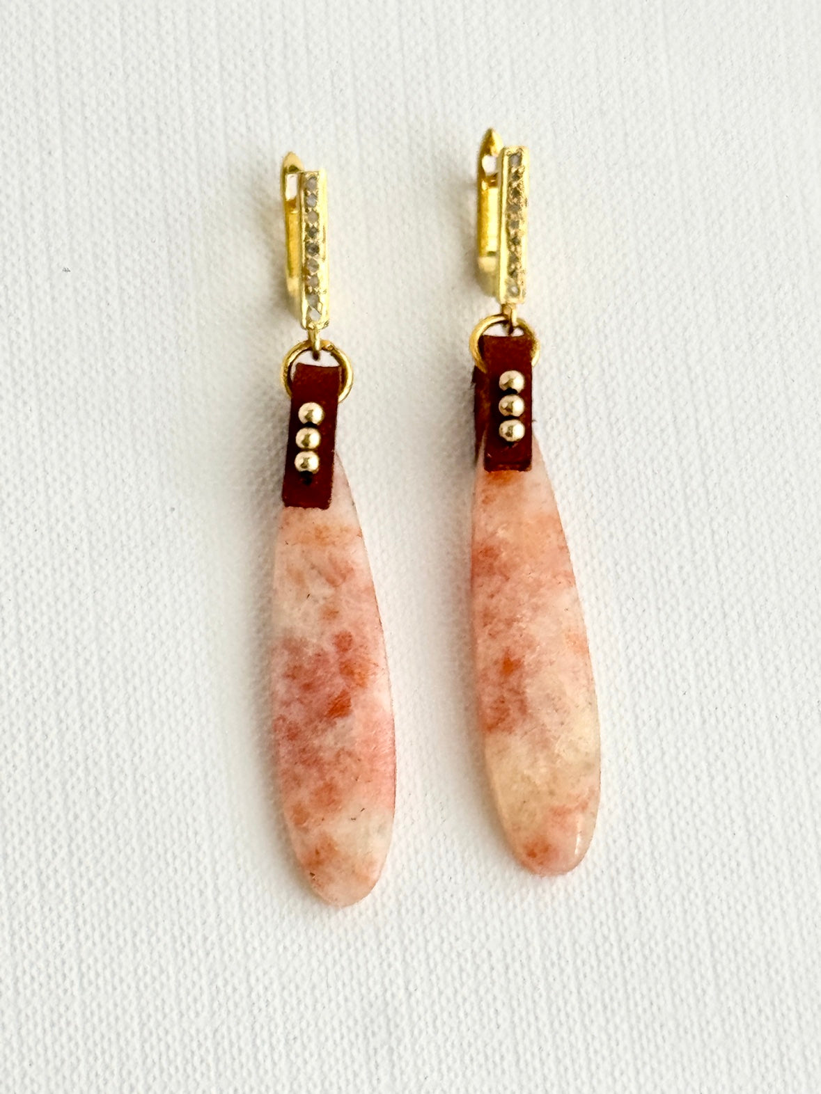 Sunstone teardrop earrings with gold-filled beads on brown leather and gold vermeil pave diamond leverbacks, pair A, straight view