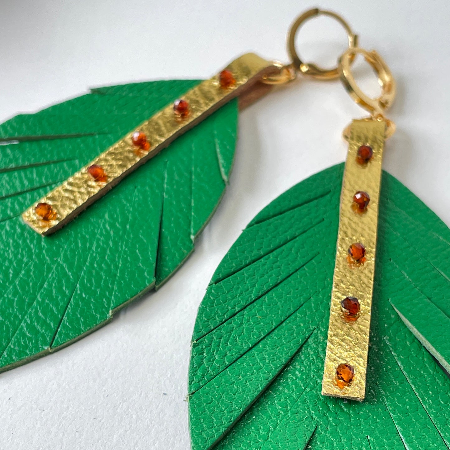 Green Leather Feather Dangle Earrings with Garnet Gemstones