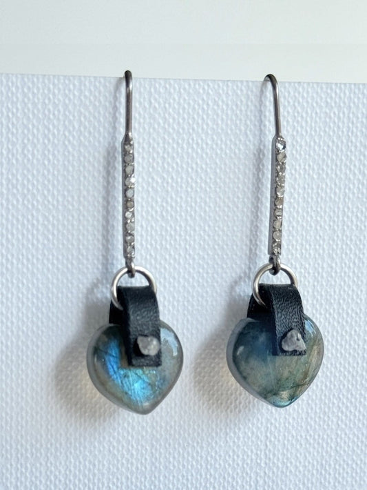 Puffy labradorite heart earrings with hand-sewn raw grey diamonds on black leather and long oxidized sterling pavé diamond bar hooks, flashing blue