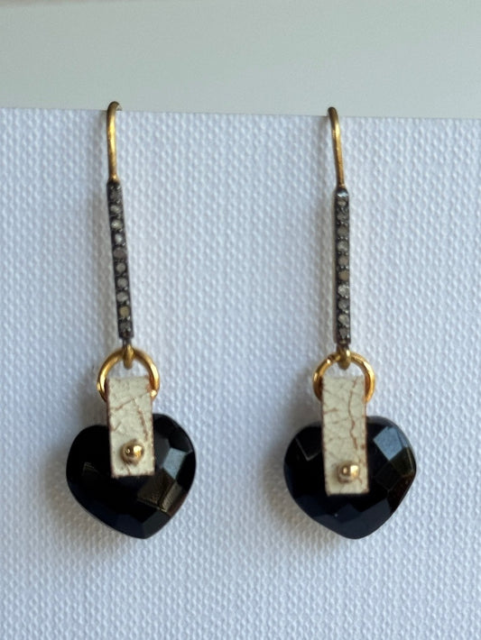 Black onyx heart dangle earrings with a hand-sewn gold bead on ivory crackle leather and two-tone pavé diamond hooks