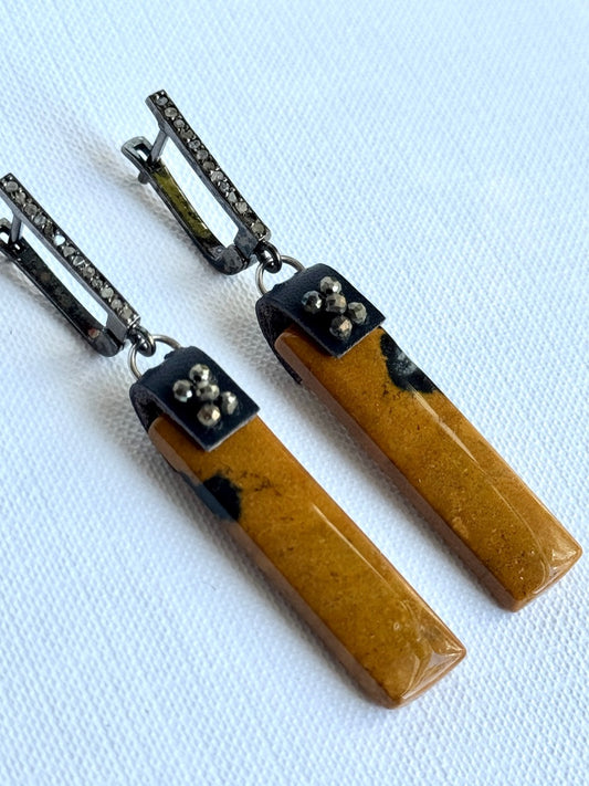 Long phantom jasper rectangle dangle earrings with hand-sewn pyrite beads on black leather and oxidized sterling pavé diamond leverback earwires, angled view