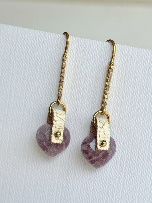 Faceted pink-red ruby heart dangle earrings with hand-sewn 14K gold-filled beads on ivory crackle leather and long gold vermeil pavé diamond hooks, front view