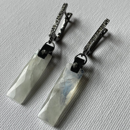 Faceted rainbow moonstone rectangle earrings with raw grey diamonds on black leather and pavé-set diamond leverbacks in sterling silver