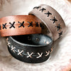 Black with natural-colored leather lacing